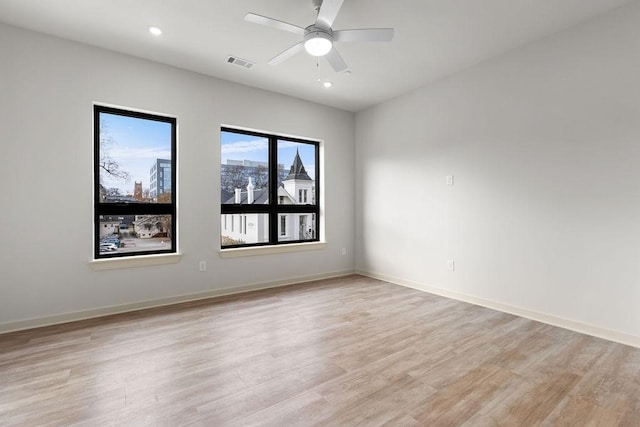 empty room featuring light hardwood / wood-style floors and ceiling fan