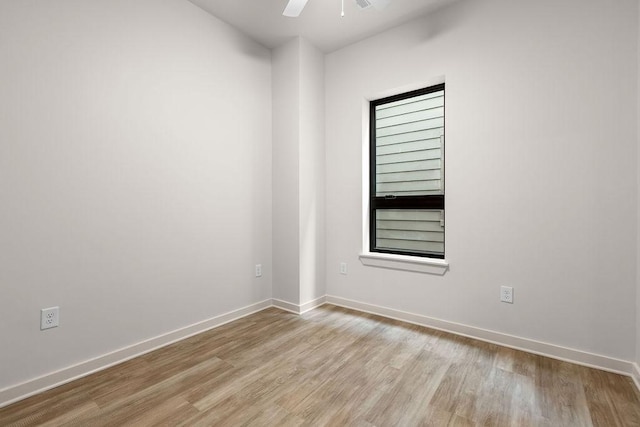 empty room featuring light hardwood / wood-style flooring and ceiling fan