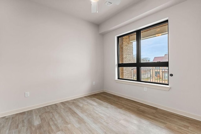 empty room featuring light wood-type flooring and ceiling fan