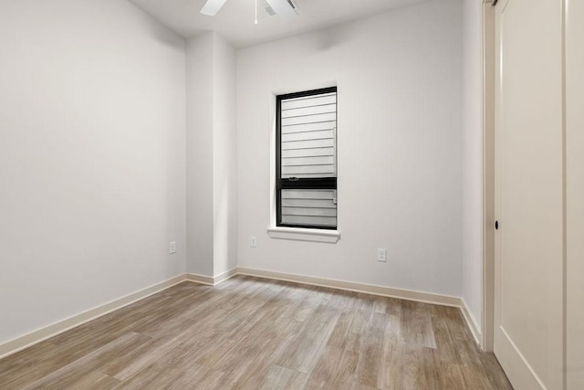 unfurnished room featuring ceiling fan and light hardwood / wood-style flooring