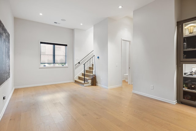 unfurnished living room with light wood-type flooring