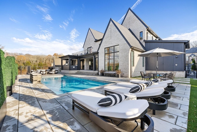 view of pool featuring a patio