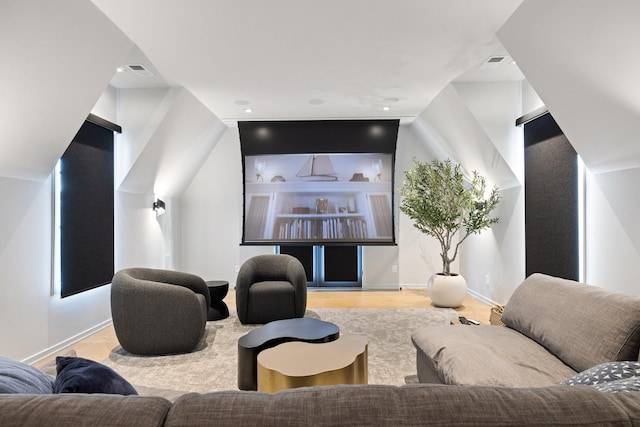 home theater room featuring light wood-type flooring