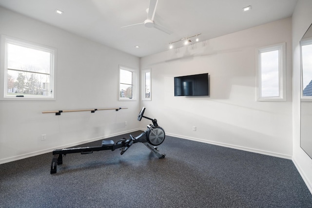 exercise room with ceiling fan