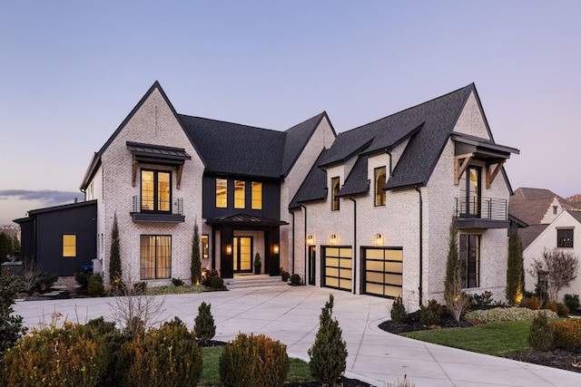 view of front of house featuring a balcony and a garage