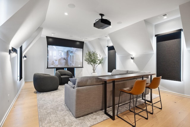 cinema room with light wood-type flooring