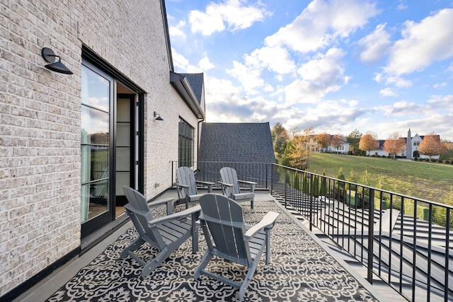 view of patio featuring a balcony