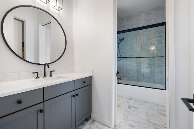 bathroom featuring vanity and shower / bath combination with glass door