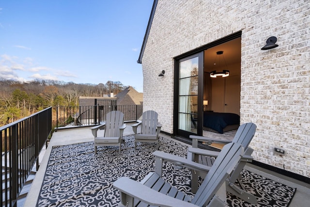 view of patio with a balcony