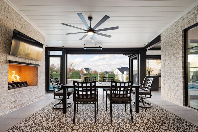 sunroom / solarium with ceiling fan and plenty of natural light