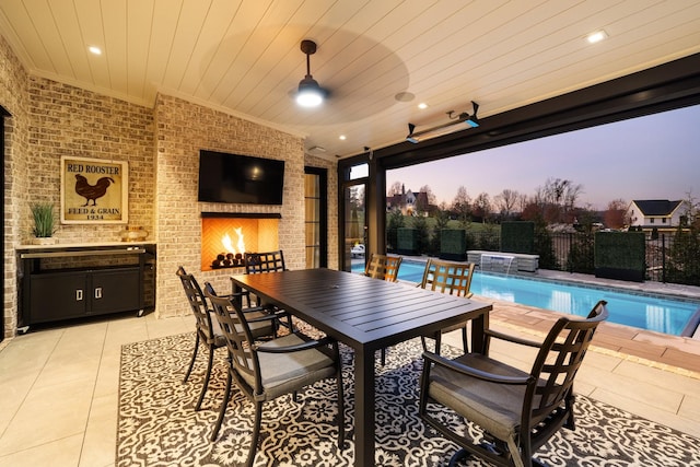 view of patio / terrace with pool water feature and a pool with hot tub