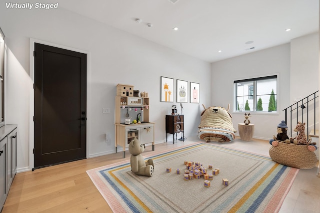 playroom featuring light wood-style flooring, baseboards, and recessed lighting