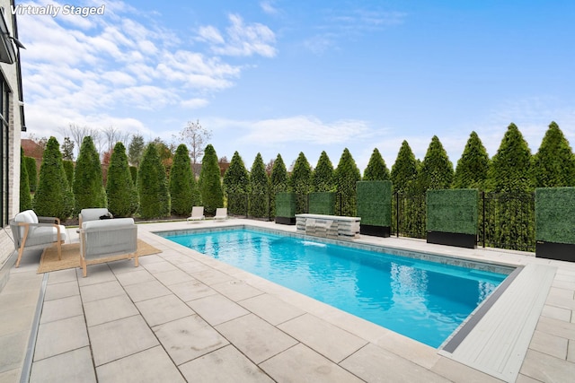view of pool with fence, a patio, and a fenced in pool