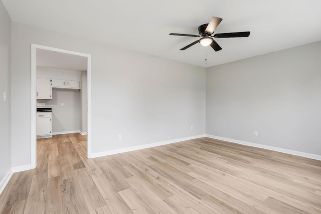 unfurnished room featuring ceiling fan and light hardwood / wood-style floors