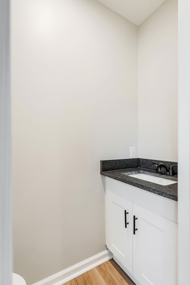 bathroom featuring hardwood / wood-style floors and vanity