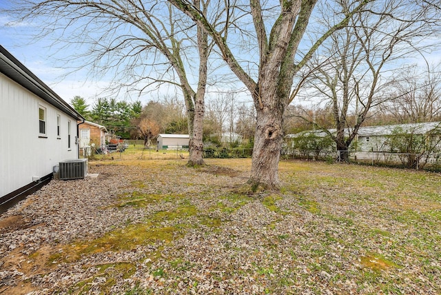 view of yard featuring central air condition unit