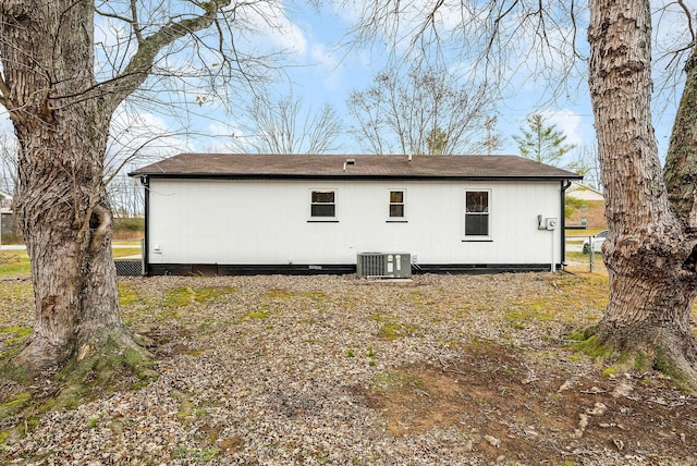 rear view of house featuring cooling unit