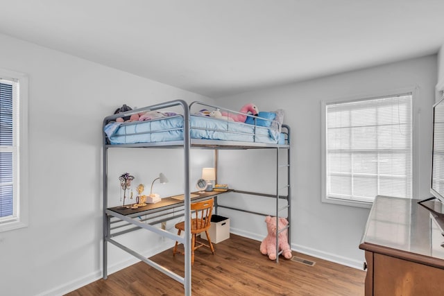 bedroom featuring hardwood / wood-style floors