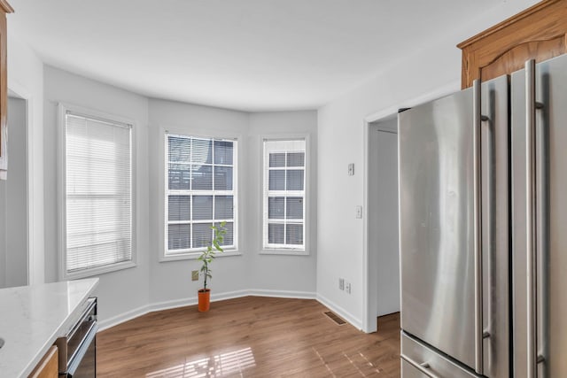 unfurnished dining area with hardwood / wood-style floors