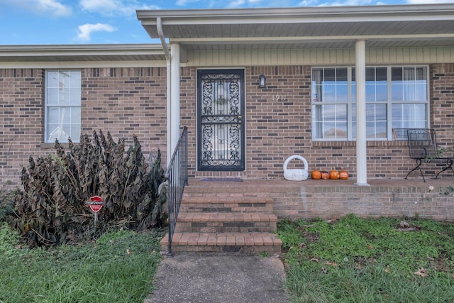 property entrance with covered porch