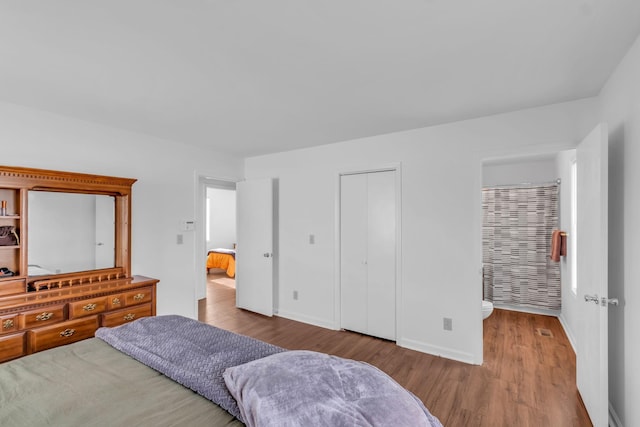 bedroom with a closet and light hardwood / wood-style flooring