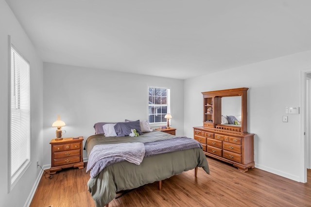 bedroom with wood-type flooring