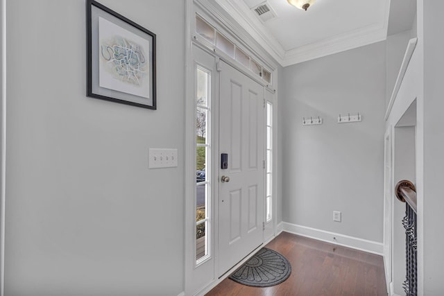 foyer featuring dark hardwood / wood-style flooring and ornamental molding