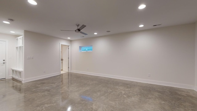 spare room with concrete flooring and ceiling fan