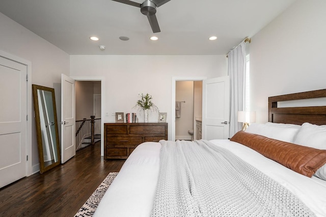 bedroom with ceiling fan, dark hardwood / wood-style flooring, and ensuite bath