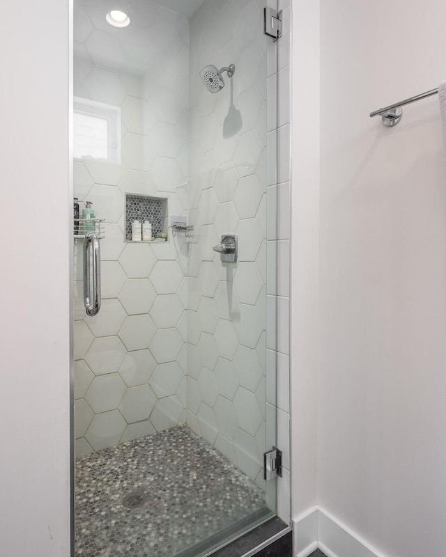 bathroom featuring an enclosed shower