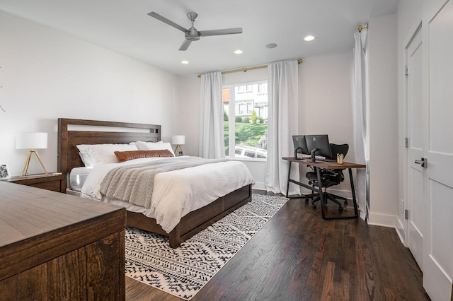 bedroom featuring dark hardwood / wood-style flooring and ceiling fan