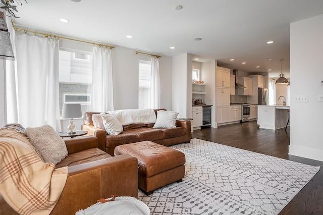 living room featuring wine cooler and dark wood-type flooring