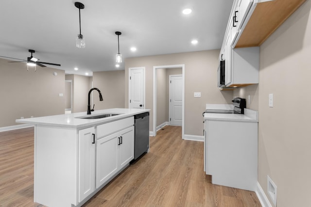 kitchen with white cabinetry, sink, stainless steel dishwasher, decorative light fixtures, and a center island with sink