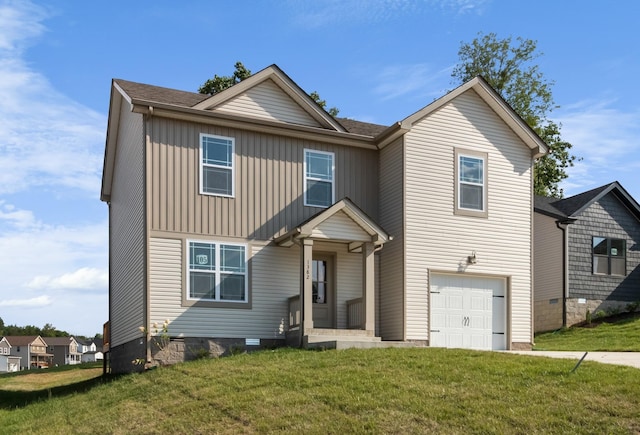 view of front property with a garage and a front lawn