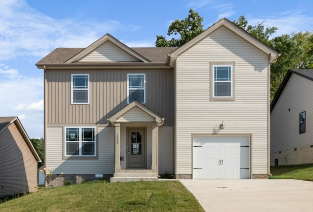 view of front of home featuring a front yard and a garage