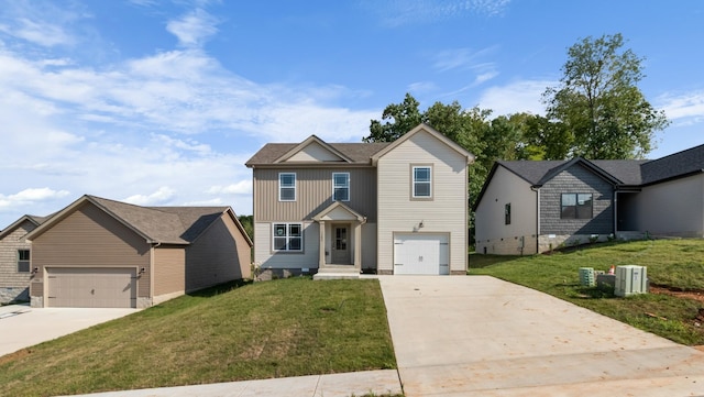 view of front of property featuring a garage and a front lawn