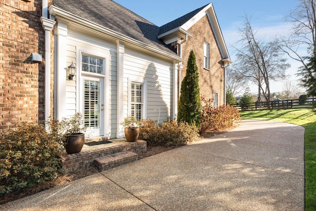 view of property exterior with a patio area