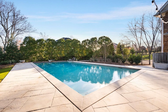 view of swimming pool featuring a patio