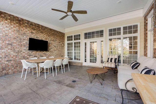 view of patio with outdoor lounge area, ceiling fan, and french doors