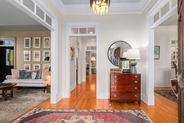 corridor featuring wood-type flooring and crown molding