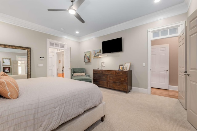 bedroom with ceiling fan, light colored carpet, and ornamental molding