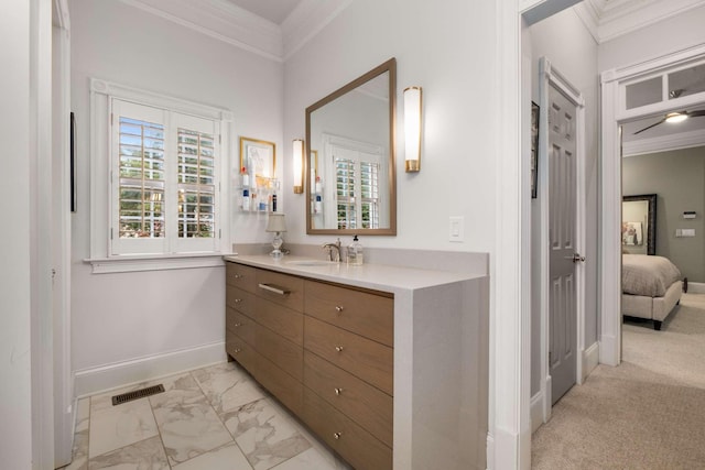 bathroom with vanity and ornamental molding