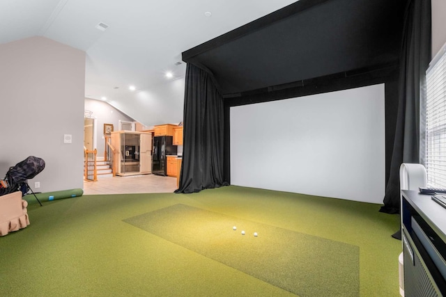 recreation room featuring light carpet, vaulted ceiling, and golf simulator