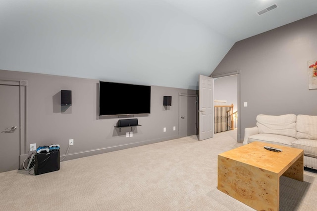 carpeted living room with vaulted ceiling