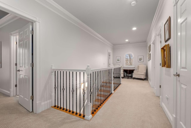 corridor with light colored carpet and ornamental molding