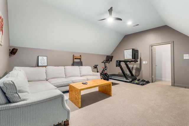 living room featuring ceiling fan, carpet floors, and lofted ceiling