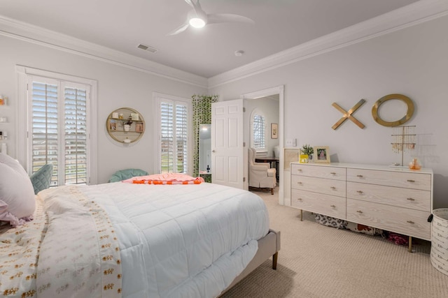 carpeted bedroom featuring ceiling fan, crown molding, and multiple windows