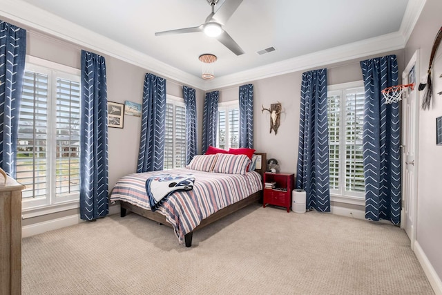 bedroom with carpet, ceiling fan, and crown molding