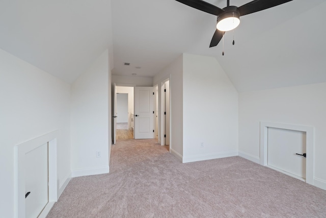 bonus room with light carpet, ceiling fan, and lofted ceiling