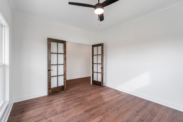 unfurnished room featuring crown molding, french doors, ceiling fan, and dark hardwood / wood-style floors